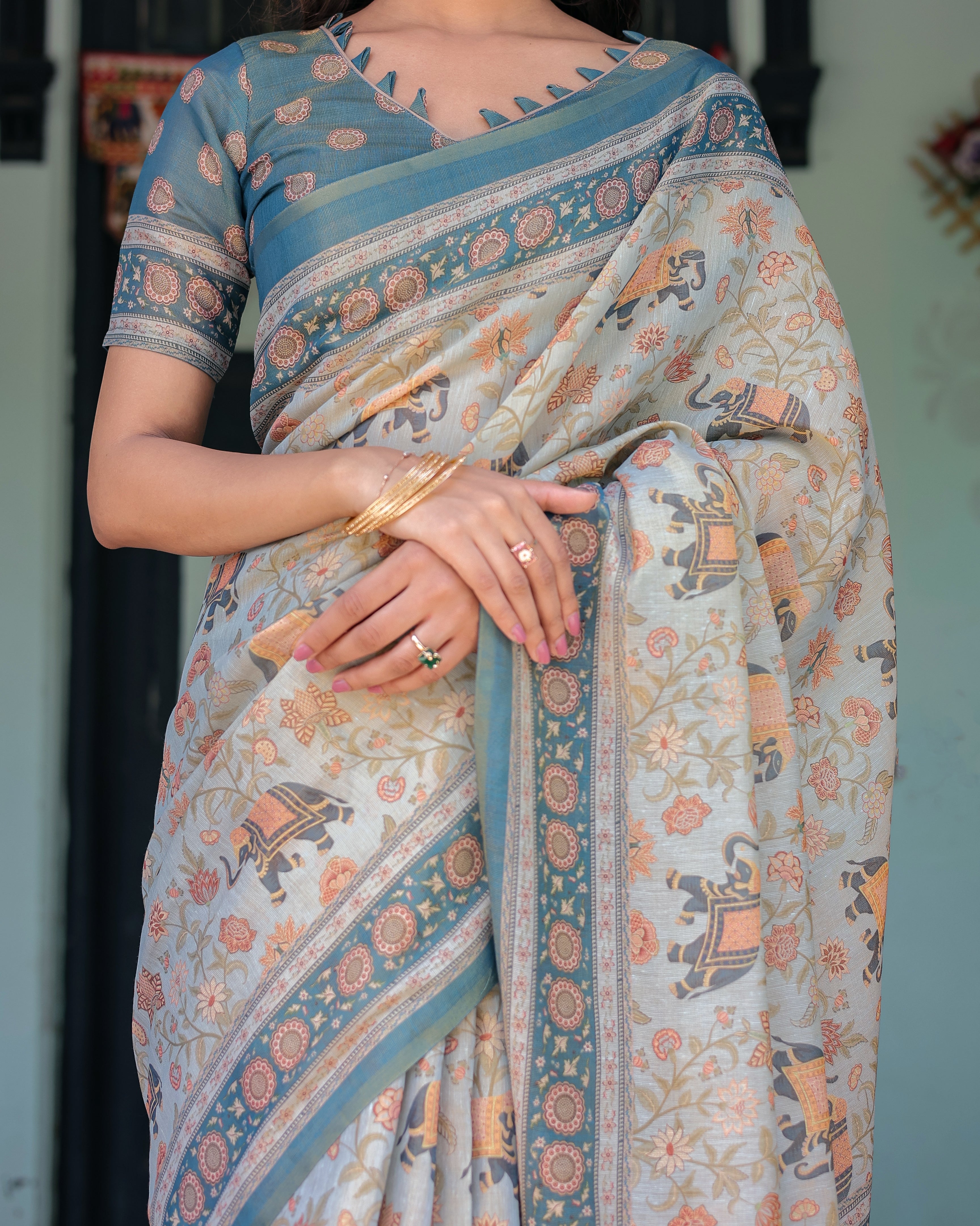 Icy Blue Handloom Cotton Saree with Peach Elephant Motifs & Royal Procession Pallu