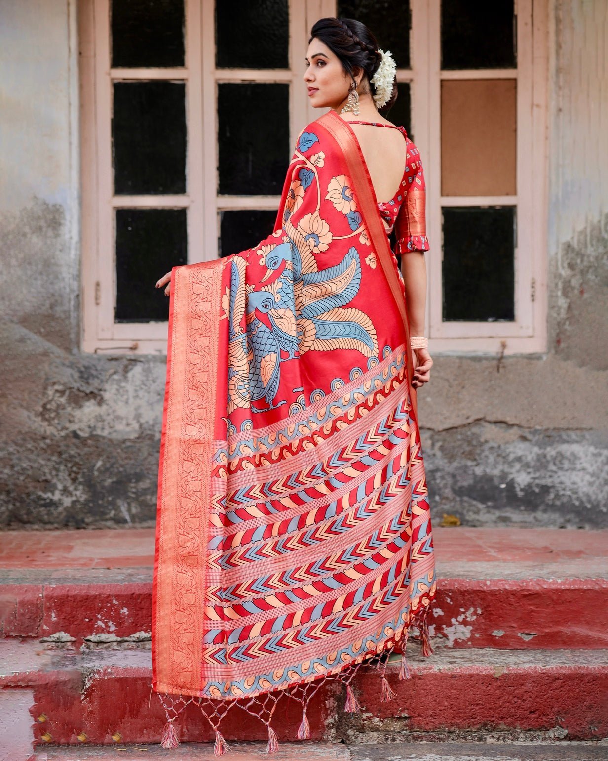 Vibrant Red Tussar Silk Saree with Bold Floral Motifs and Chevron Patterned Pallu